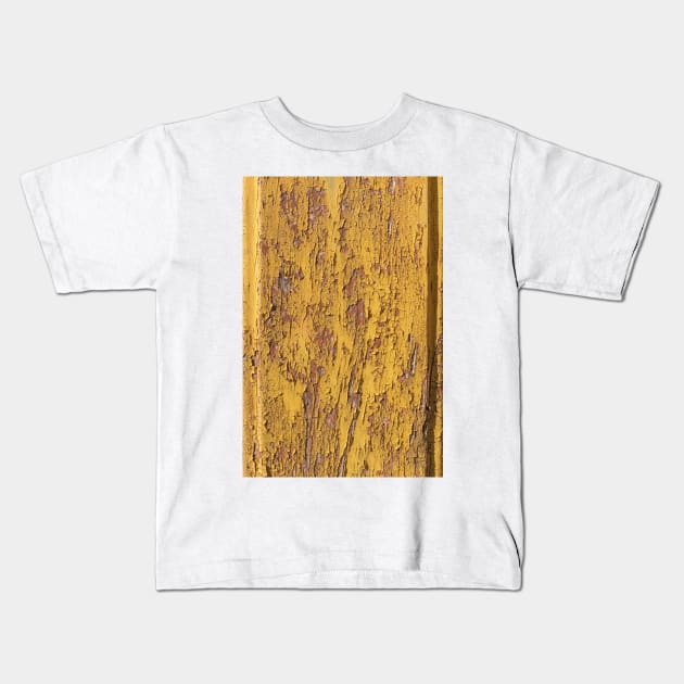 The texture of yellow wood Board can be used for background. A little cracked paintThe texture of yellow wood Board can be used for background. A little cracked paint Kids T-Shirt by AnaMOMarques